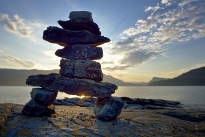 Canada, British Columbia, Russell Island. Rock inukshuk in front of Salt Spring Island.